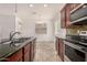 Kitchen features granite island, double sink, and breakfast nook at 7311 N 90Th Ave, Glendale, AZ 85305