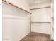 Walk-in closet with double hanging rods and shelving at 7311 N 90Th Ave, Glendale, AZ 85305