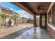 Covered patio with flagstone flooring, fountain, and sitting area at 7311 N 90Th Ave, Glendale, AZ 85305