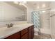 Clean bathroom with tub, shower, and updated vanity at 7311 N 90Th Ave, Glendale, AZ 85305