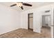 Spacious bedroom with ceiling fan and large closet at 7311 N 90Th Ave, Glendale, AZ 85305
