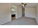 Spacious bedroom with plush carpeting and en-suite bathroom access at 8758 E Obispo Ave, Mesa, AZ 85212