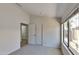 Well-lit bedroom featuring dual closets and carpet at 8758 E Obispo Ave, Mesa, AZ 85212