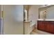 Clean bathroom with tub, shower, and wood vanity at 8758 E Obispo Ave, Mesa, AZ 85212