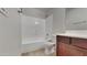 Bathroom with shower/tub combo and wood cabinet at 8758 E Obispo Ave, Mesa, AZ 85212