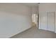 Bright bedroom with double doors and carpet at 8758 E Obispo Ave, Mesa, AZ 85212