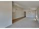 Open living room with vaulted ceilings and neutral carpeting at 8758 E Obispo Ave, Mesa, AZ 85212