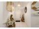 Bright entryway with a glass-top table and Asian decor at 3301 S Goldfield Rd # 3004, Apache Junction, AZ 85119
