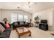 Cozy living room featuring a comfy sofa and ample natural light at 3301 S Goldfield Rd # 3004, Apache Junction, AZ 85119