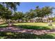 Enjoy a relaxing putting green with palm trees and landscaping at 3301 S Goldfield Rd # 3004, Apache Junction, AZ 85119