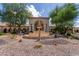Elegant community entrance with a grand fountain and landscaping at 3301 S Goldfield Rd # 3004, Apache Junction, AZ 85119