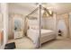Main bedroom with a four-poster canopy bed and ensuite access at 3301 S Goldfield Rd # 3004, Apache Junction, AZ 85119