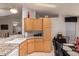 Bright kitchen with ample cabinetry and granite countertops at 3301 S Goldfield Rd # 3004, Apache Junction, AZ 85119