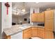 Kitchen features granite countertops and light wood cabinets at 3301 S Goldfield Rd # 3004, Apache Junction, AZ 85119