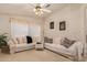 Living room with off-white couch and ceiling fan at 3301 S Goldfield Rd # 3004, Apache Junction, AZ 85119