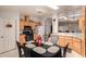 Well-equipped kitchen with light wood cabinets, granite countertops, and a breakfast nook at 3301 S Goldfield Rd # 3004, Apache Junction, AZ 85119