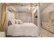Spacious bedroom with a four-poster canopy bed and dresser at 3301 S Goldfield Rd # 3004, Apache Junction, AZ 85119