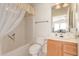 Clean bathroom with a tub, toilet, and wood vanity at 3301 S Goldfield Rd # 3004, Apache Junction, AZ 85119