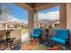 Cozy patio with two rocking chairs and colorful rug at 846 N Pueblo Dr # 126, Casa Grande, AZ 85122