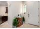 Bright entryway with kitchen view, decorative accents, and neutral-toned flooring at 846 N Pueblo Dr # 126, Casa Grande, AZ 85122