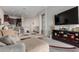 Open living area with kitchen, neutral decor, and a wall-mounted TV at 846 N Pueblo Dr # 126, Casa Grande, AZ 85122