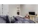 Bedroom with a double bed, TV, and ensuite bathroom access at 846 N Pueblo Dr # 126, Casa Grande, AZ 85122