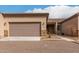Tan colored home with a two-car garage and walkway at 846 N Pueblo Dr # 126, Casa Grande, AZ 85122