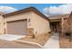 Tan colored home with a two-car garage and walkway at 846 N Pueblo Dr # 126, Casa Grande, AZ 85122
