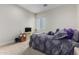 Bedroom with carpeted floor, a queen-size bed, and a wall-mounted TV at 846 N Pueblo Dr # 126, Casa Grande, AZ 85122