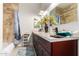 Bathroom with double vanity, bathtub, and tiled walls at 846 N Pueblo Dr # 126, Casa Grande, AZ 85122