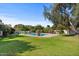 Large pool surrounded by lush lawn and mature trees at 6516 E Maverick Rd, Paradise Valley, AZ 85253