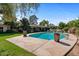 Large kidney shaped pool with spacious patio at 6516 E Maverick Rd, Paradise Valley, AZ 85253