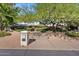 Front view of a single story home with mature landscaping at 6516 E Maverick Rd, Paradise Valley, AZ 85253