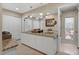 Double vanity bathroom with granite countertops and a large mirror at 6516 E Maverick Rd, Paradise Valley, AZ 85253