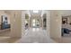 Long hallway with arched doorways and tile flooring at 6516 E Maverick Rd, Paradise Valley, AZ 85253