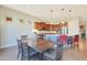 Kitchen dining area with wood table and chairs, and an abundance of natural light at 17900 W Briarwood Dr, Goodyear, AZ 85338