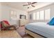 Bedroom with a chaise lounge and large windows at 183 W Evergreen Pear Ave, Queen Creek, AZ 85140