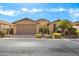 Beautiful single-story home with a well-manicured front yard and attached garage at 183 W Evergreen Pear Ave, Queen Creek, AZ 85140