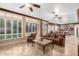 Bright living room with hardwood floors and large windows at 7640 E Snowdon Cir, Mesa, AZ 85207