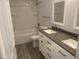 Double vanity bathroom with a soaking tub and tile flooring at 14207 N 51St Dr, Glendale, AZ 85306