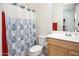 Clean bathroom with shower/tub combo and wood vanity at 10020 E Strobe Ave, Mesa, AZ 85212
