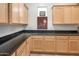 Large kitchen with granite countertops and light wood cabinets at 10020 E Strobe Ave, Mesa, AZ 85212