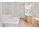 Elegant bathroom with double vanity, soaking tub, and separate shower at 10020 E Strobe Ave, Mesa, AZ 85212