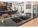 Kitchen island with a double sink and modern faucet fixture at 10020 E Strobe Ave, Mesa, AZ 85212
