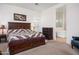 Bright bedroom with king-size bed and en-suite bathroom with soaking tub at 10020 E Strobe Ave, Mesa, AZ 85212