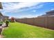 Large backyard with grassy area and block wall at 10020 E Strobe Ave, Mesa, AZ 85212