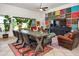 Open living area features a rustic wooden table and eclectic decor at 10020 E Strobe Ave, Mesa, AZ 85212