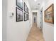Bright hallway with tile flooring and framed artwork on the wall at 10020 E Strobe Ave, Mesa, AZ 85212