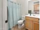 Clean bathroom with shower/tub and wood vanity at 10020 E Strobe Ave, Mesa, AZ 85212