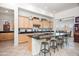 Spacious kitchen with an island, granite countertops, and stainless steel appliances at 10020 E Strobe Ave, Mesa, AZ 85212